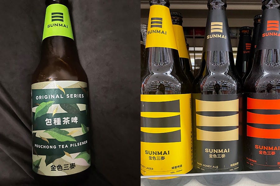 金色三麥(SUNMAI )の瓶ビール。左側に緑のラベル、右側には黄色、ベージュ、赤基調のラベルの瓶。